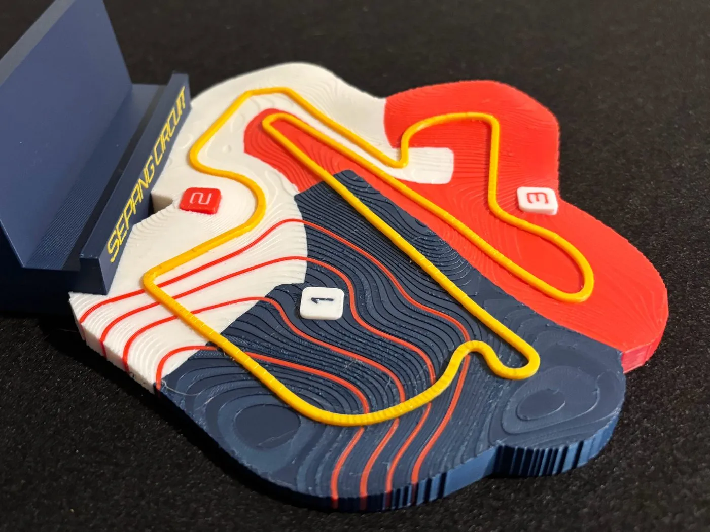 The Sepang plate, with red contour lines ringing the basin in the blue first sector